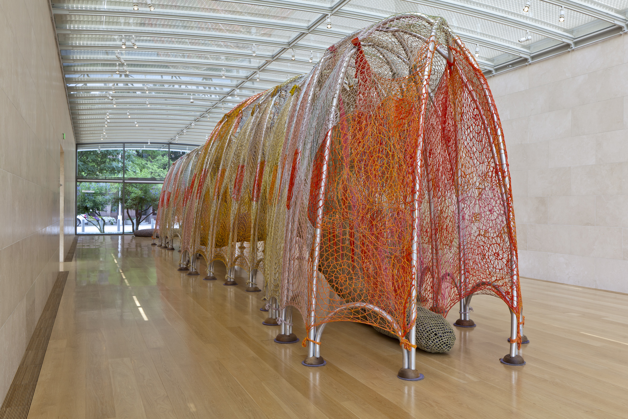 Ernesto Neto’s work is meant to awaken our primal selves by inviting interaction