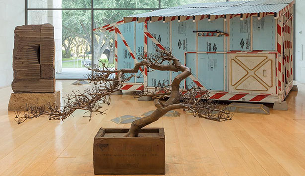 Image of an artistically rendered tree in front of a powder blue trailer