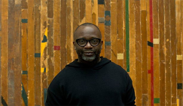 2018 Nasher Prize Laureate standing in front of a piece in the National Gallery of Art