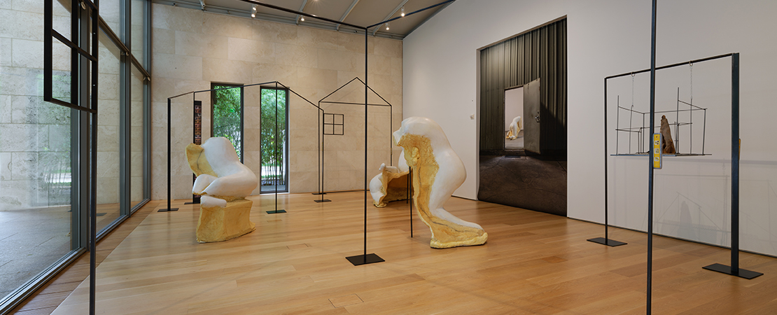 Frances Bagley's installation of partial figures and the outlines of a house.