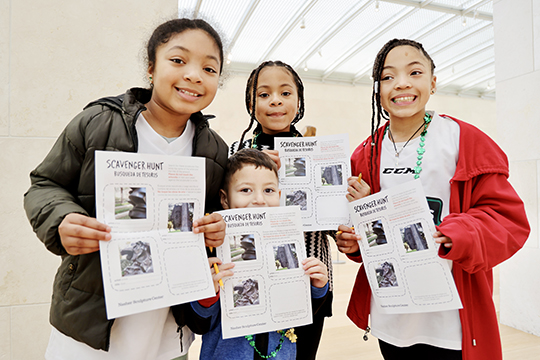 Three girls hold scavenger hunts in the galleries